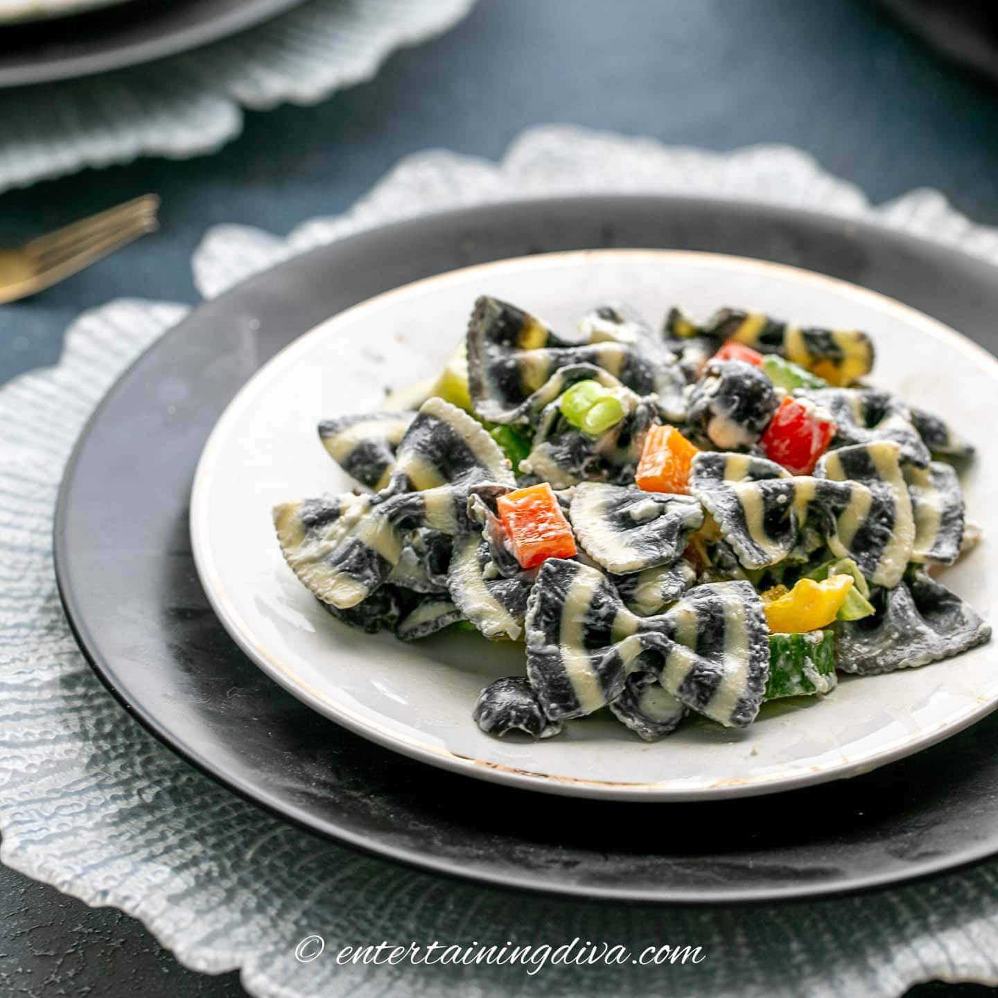 A plate of black and white bow tie pasta salad at a Phantom of the Opera Party.