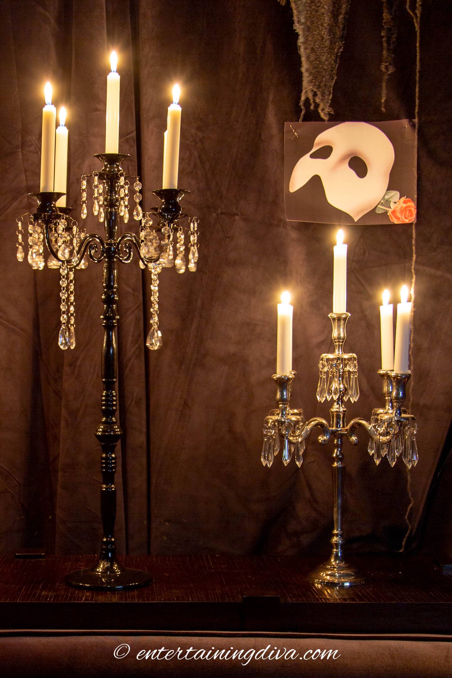 Two candelabras on a table at a Phantom of the Opera party
