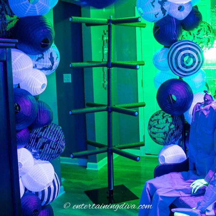 DIY Beetlejuice turnstile under a paper lantern arch
