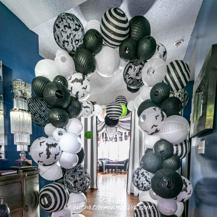 A DIY black and white paper lantern arch
