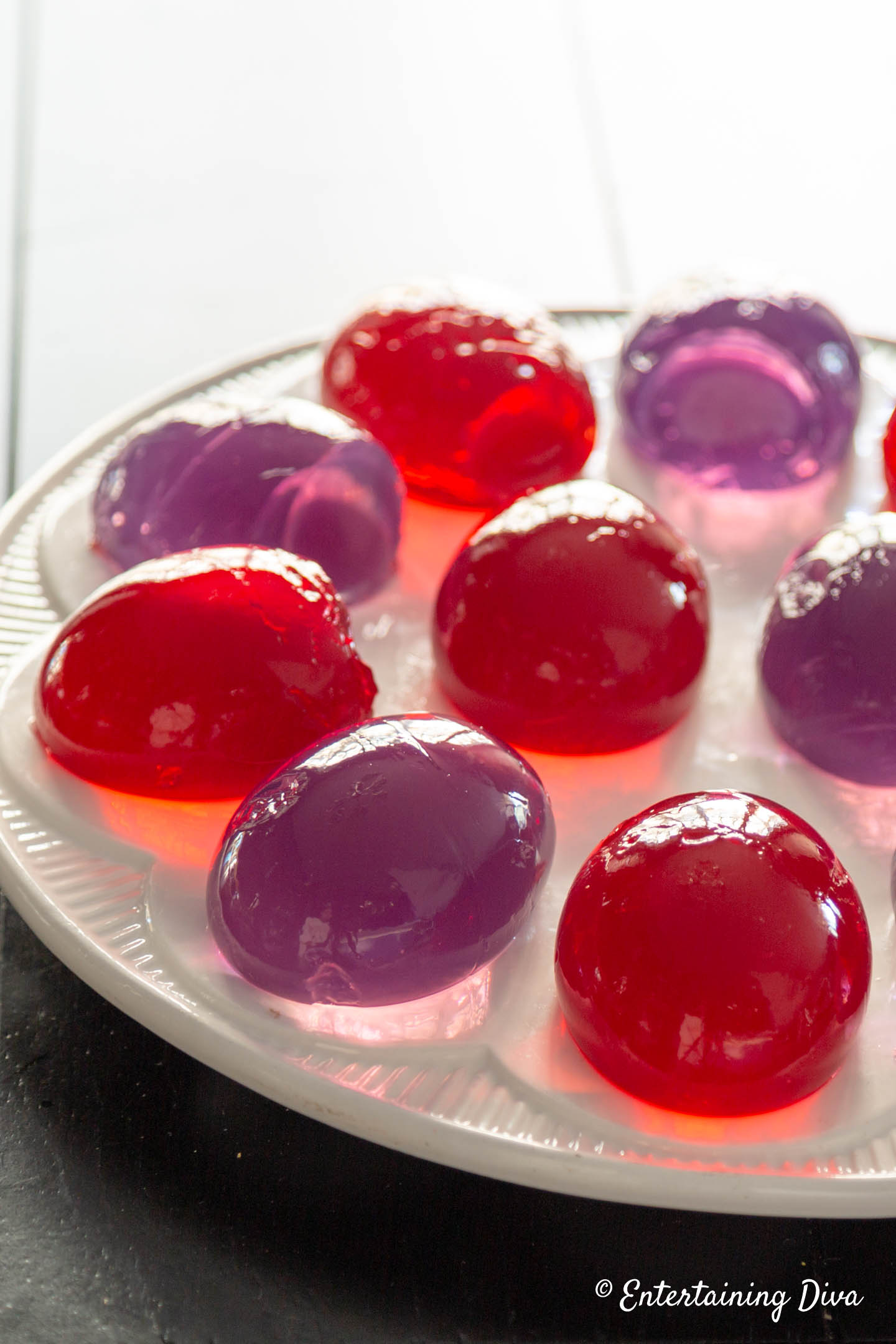 A close up view of Jello Easter Eggs on a deviled egg plate