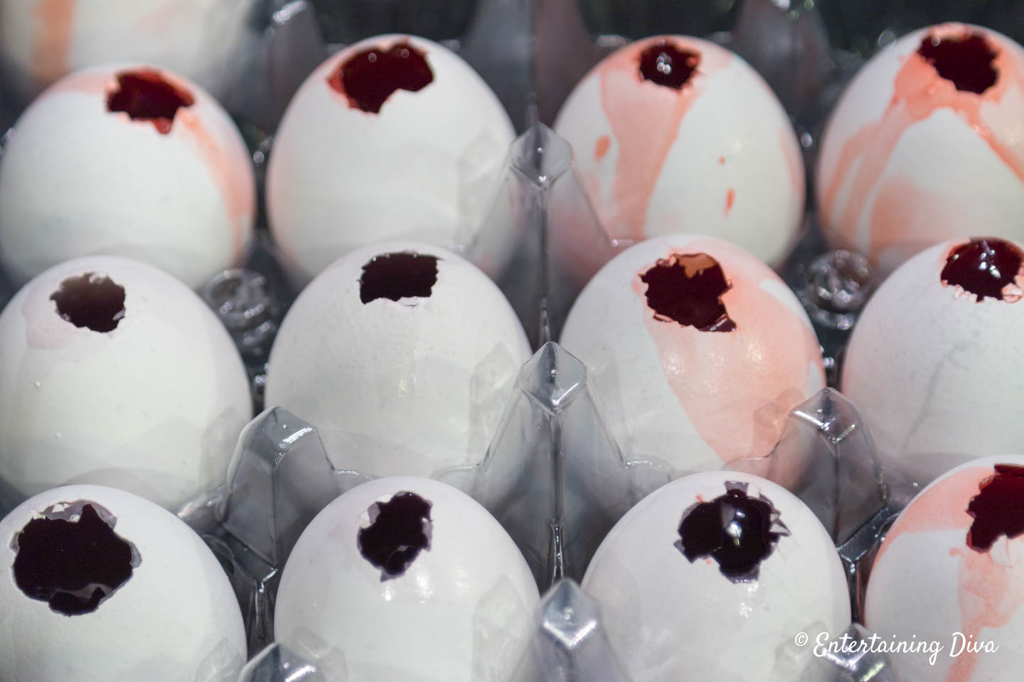 Egg shells filled with Jello in an egg carton