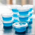blue hawaiian jello shots stacked on a table