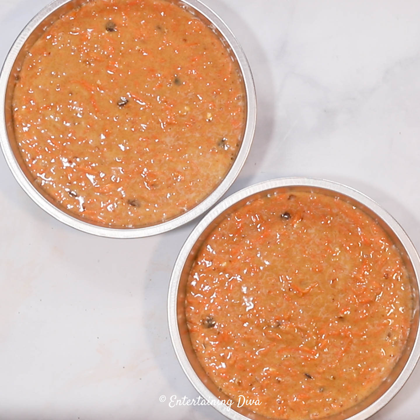 Carrot cake batter in round cake pans