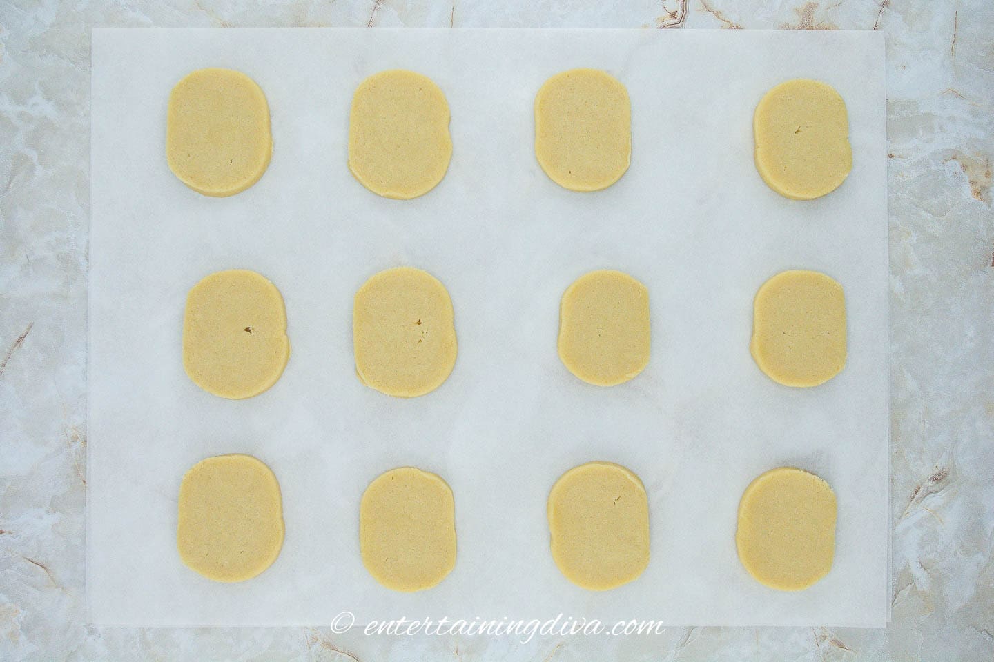 Round sugar cookies on parchment paper