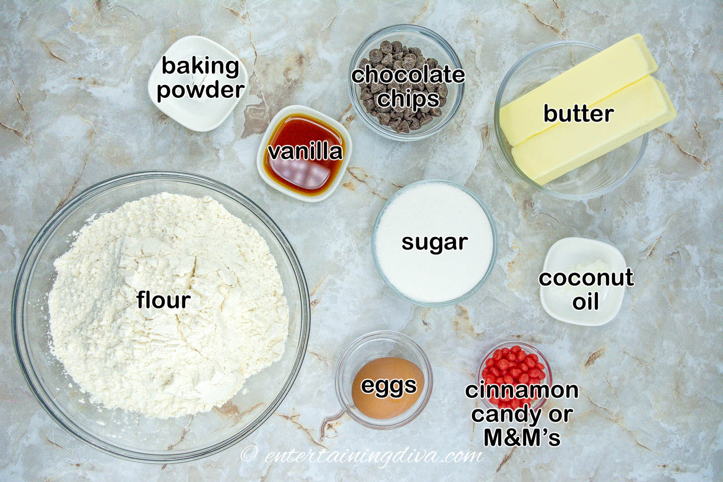 The ingredients for reindeer sugar cookies on a marble table.