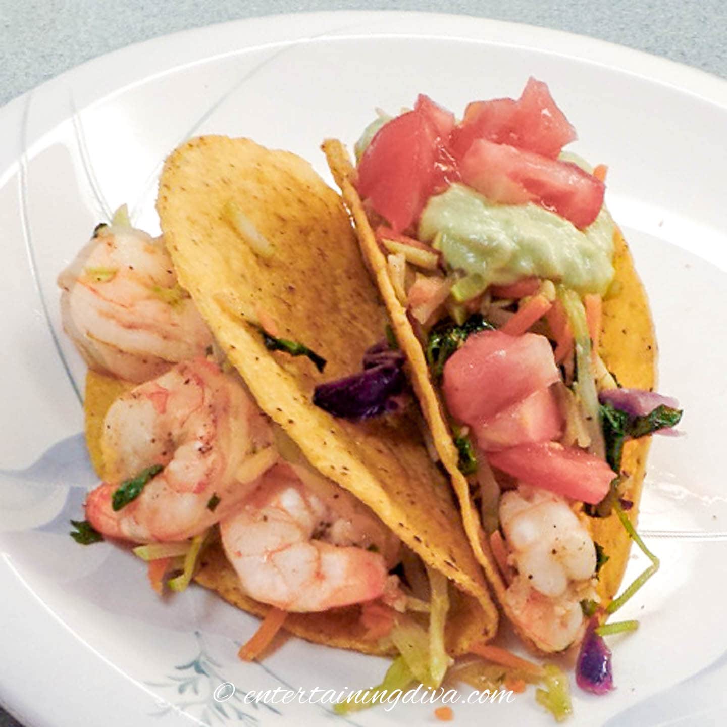 two shrimp tacos on a plate