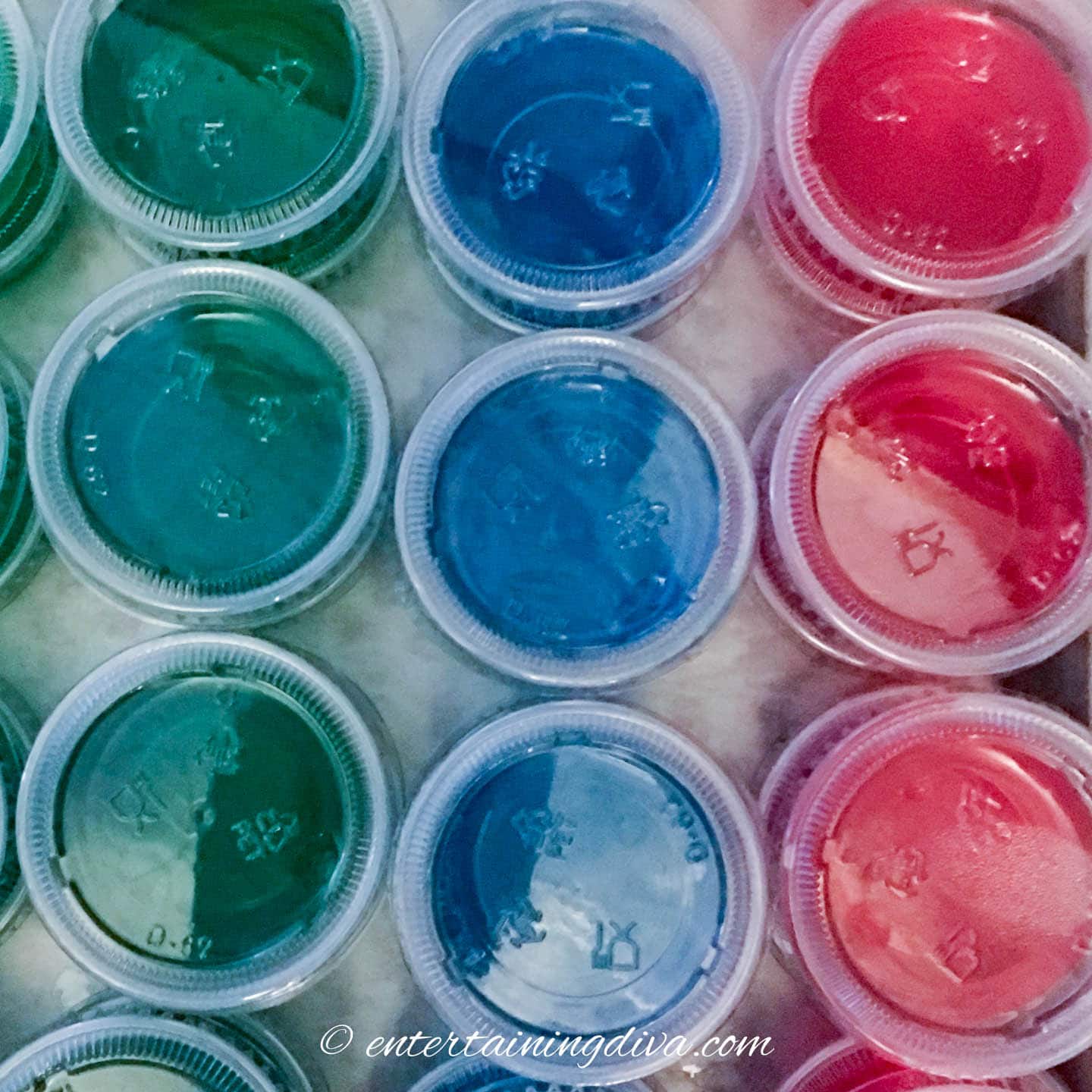 Green, blue and red vodka jello shots
