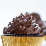 chocolate icing on top of a cupcake