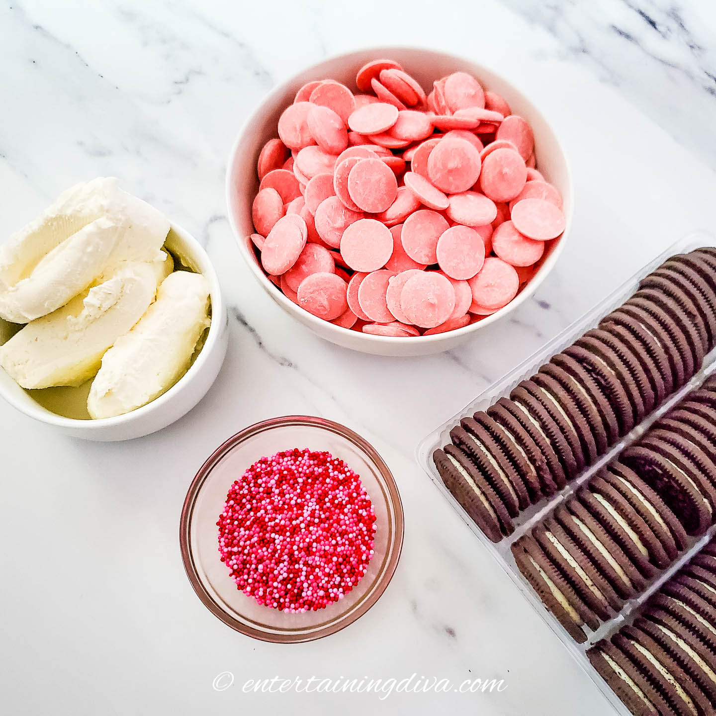 Valentine Oreo balls ingredients - cream cheese, pink melting candy, sprinkles and Oreo cookies