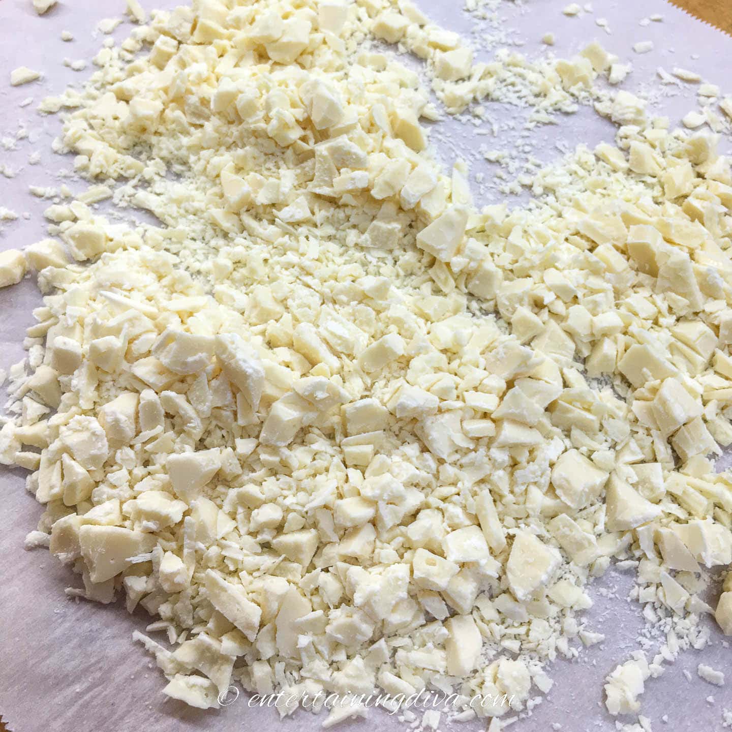 chopped white chocolate on a piece of parchment paper