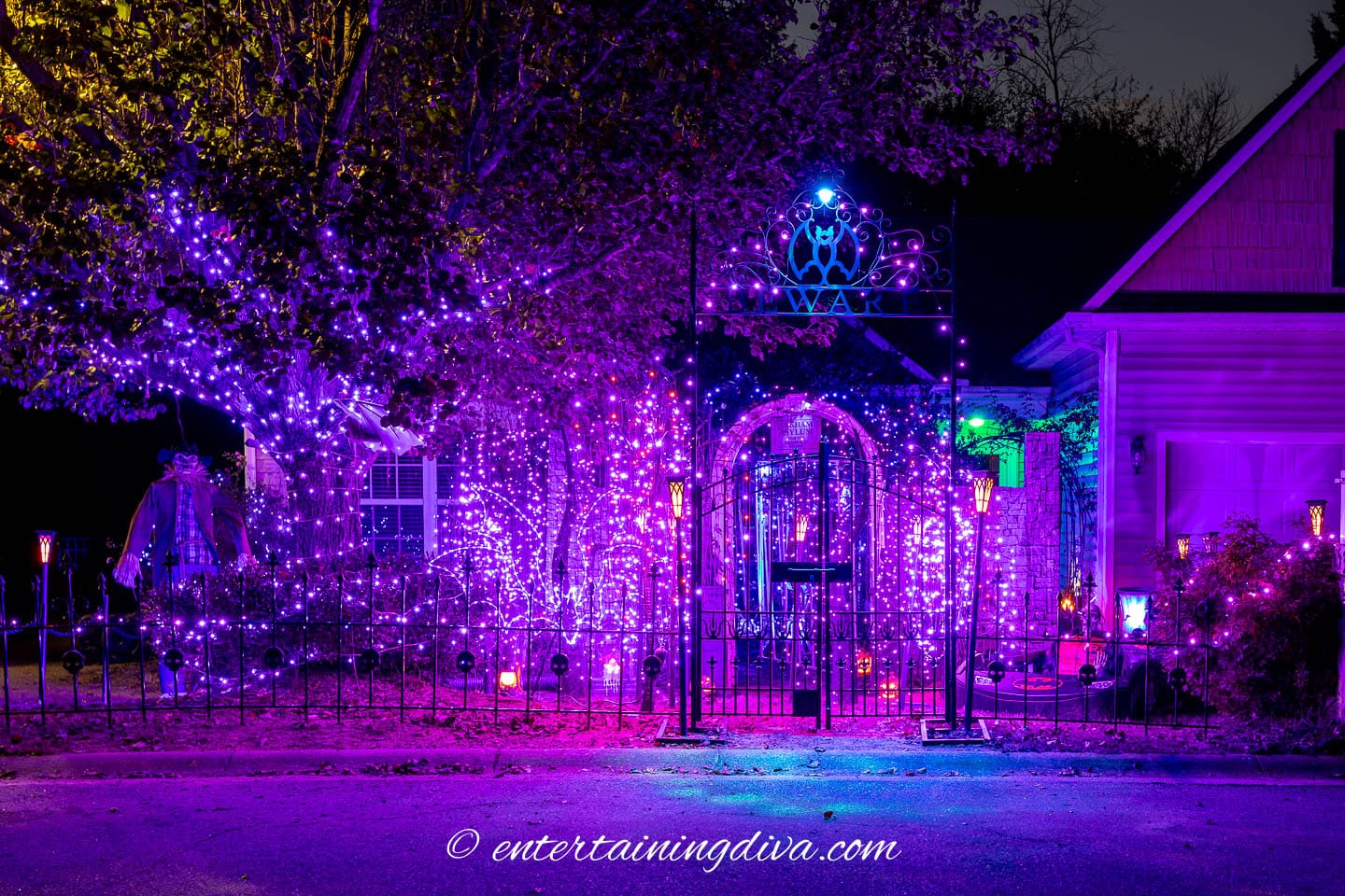 Batman Arkham Asylum outdoor Hallwoeen decor with lots of purple lights