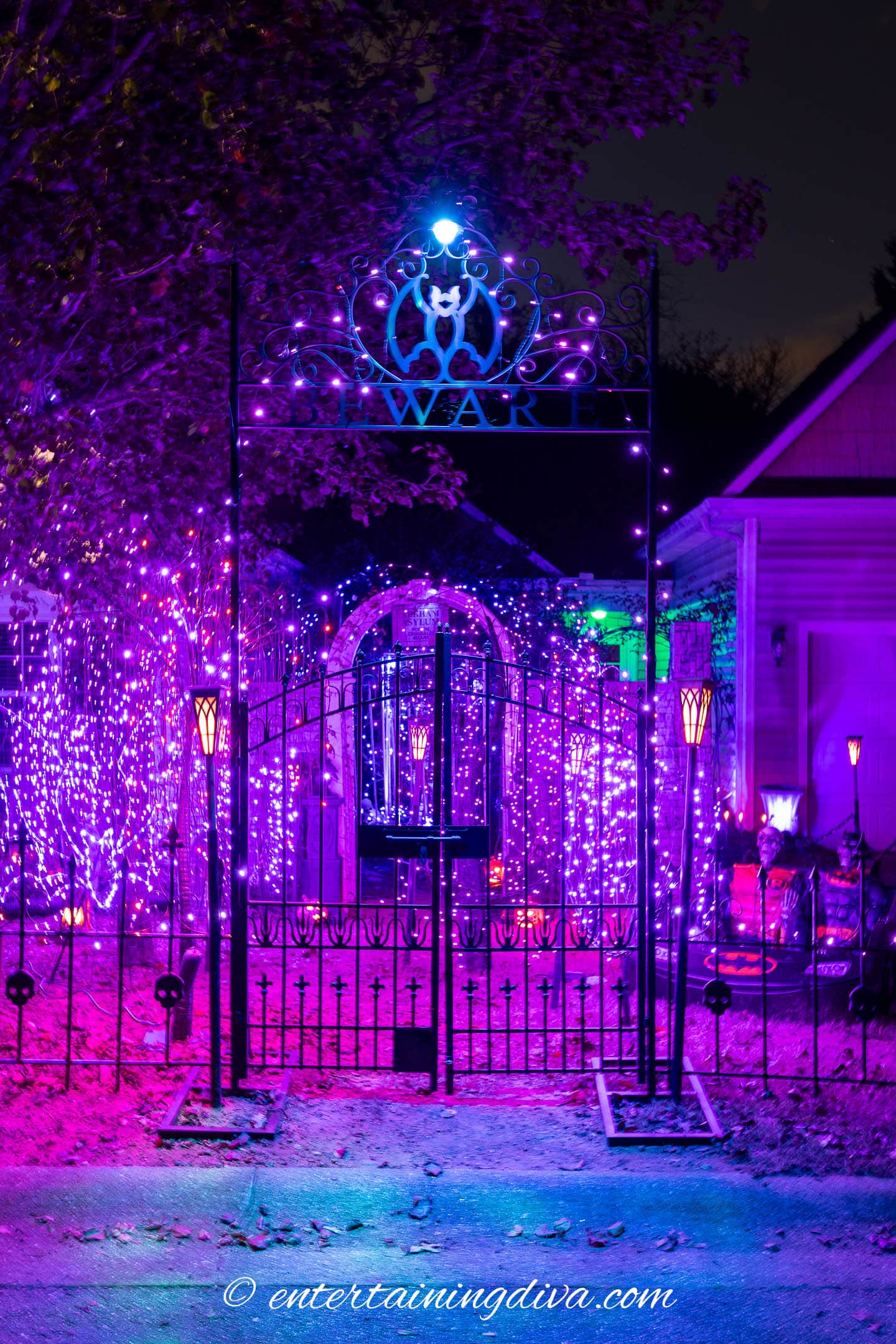 metal bat Halloween arbor at night with lights
