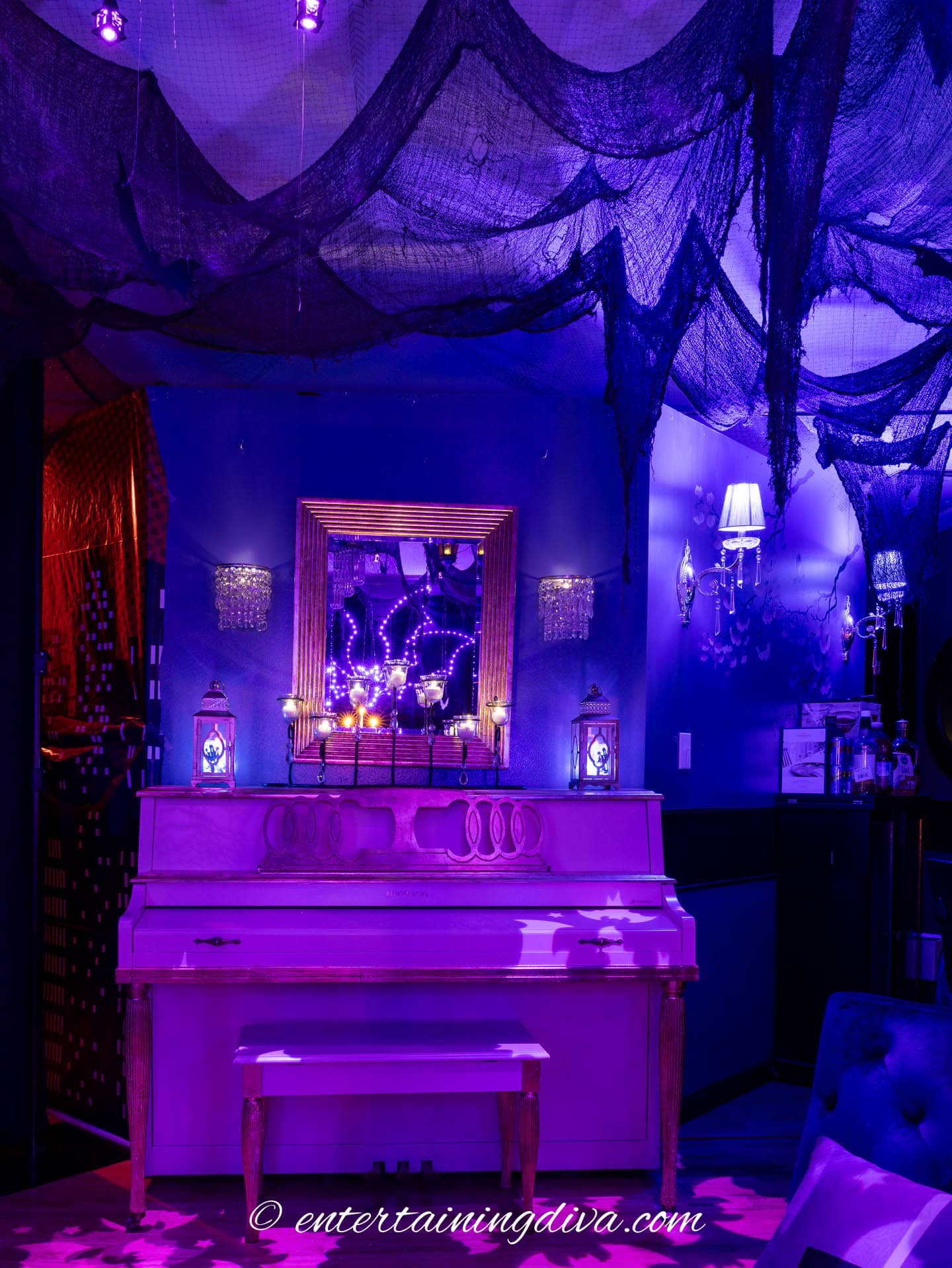 flameless candles on a piano at a batman party