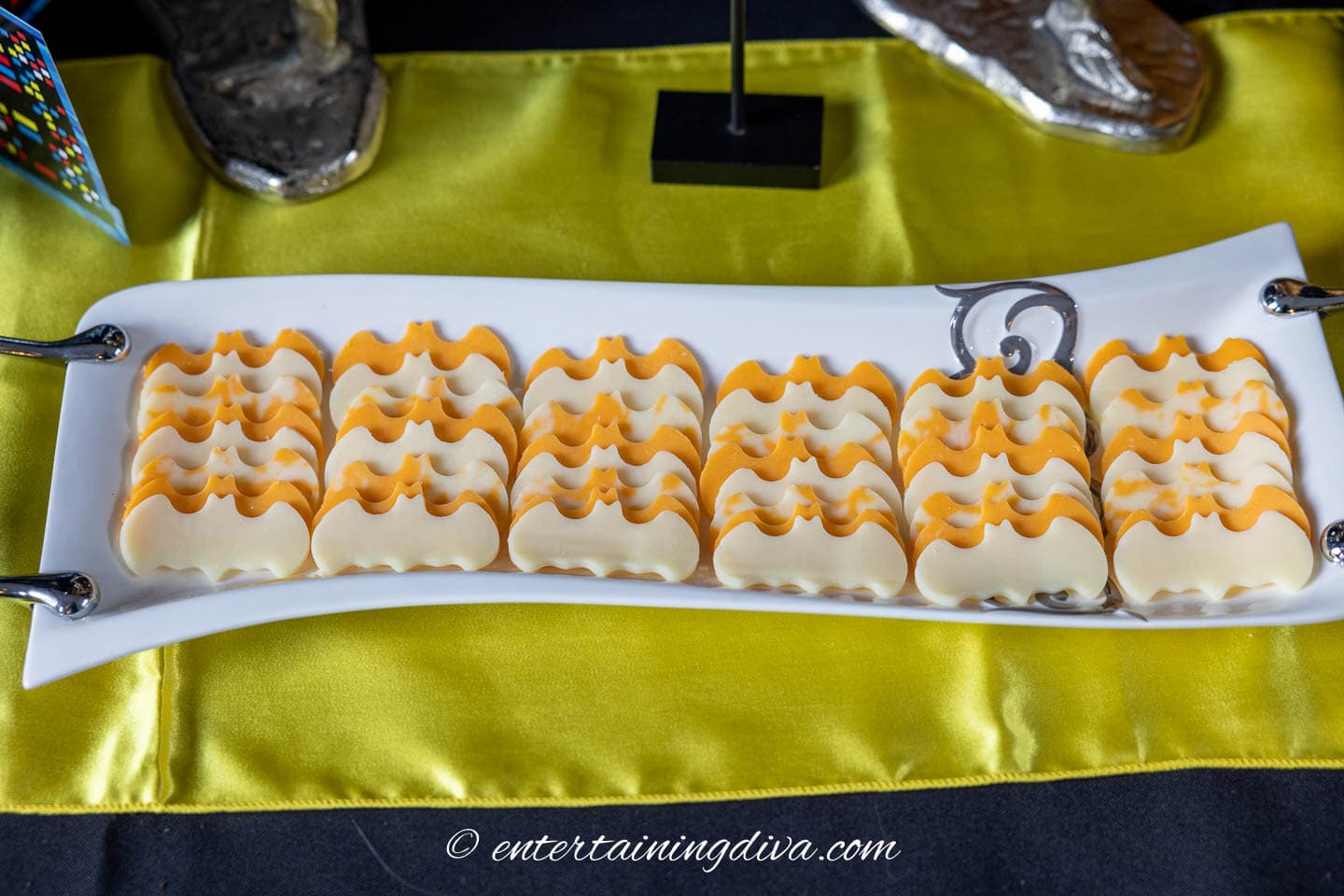 slices of cheese cut into bat shapes at a batman party