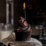 a skull Halloween cupcake with a candle