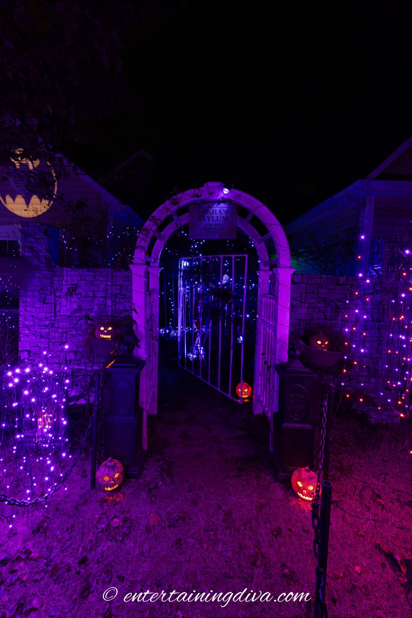 Pumpkins in a Halloween outdoor yard display at night