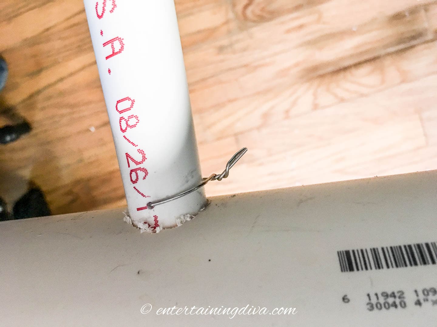 A wire wrapped around a small PVC pipe