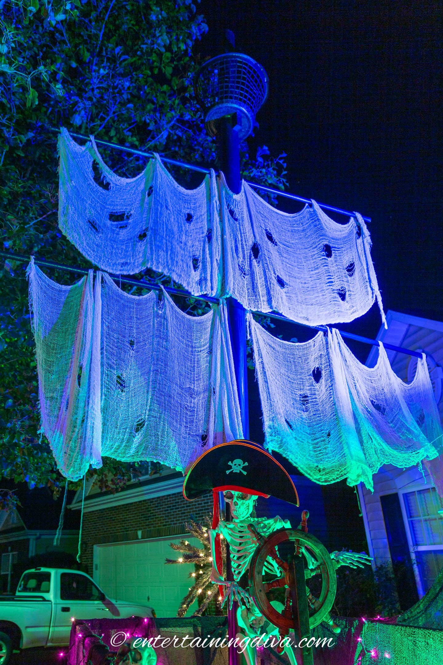 The sail of the DIY pirate ship with a crow's nest on top