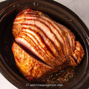close up of a spiral ham in a slow cooker after cooking