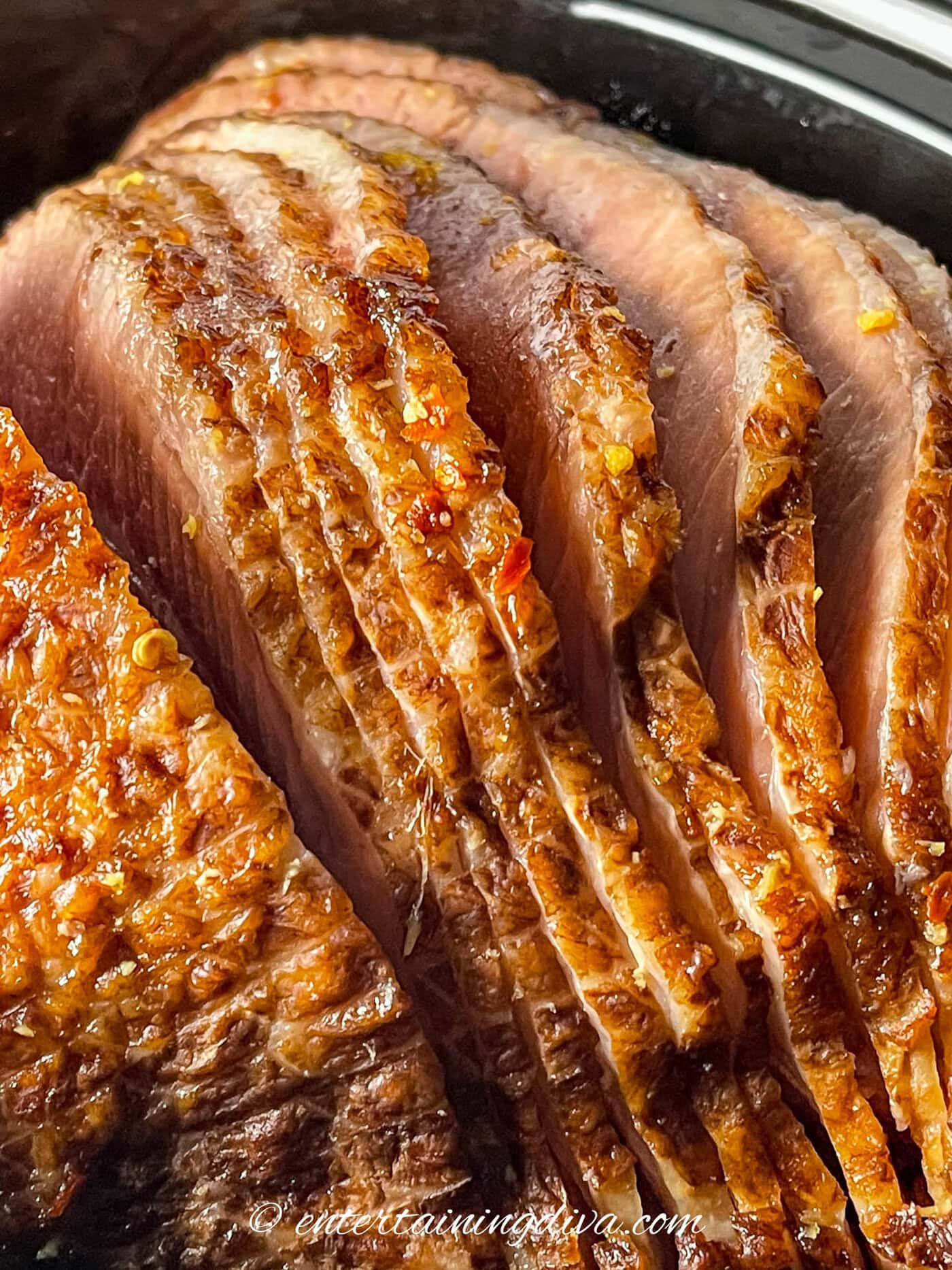 close up of a crock pot ham