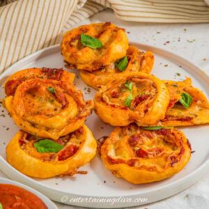 close up of pepperoni pinwheels on a plate
