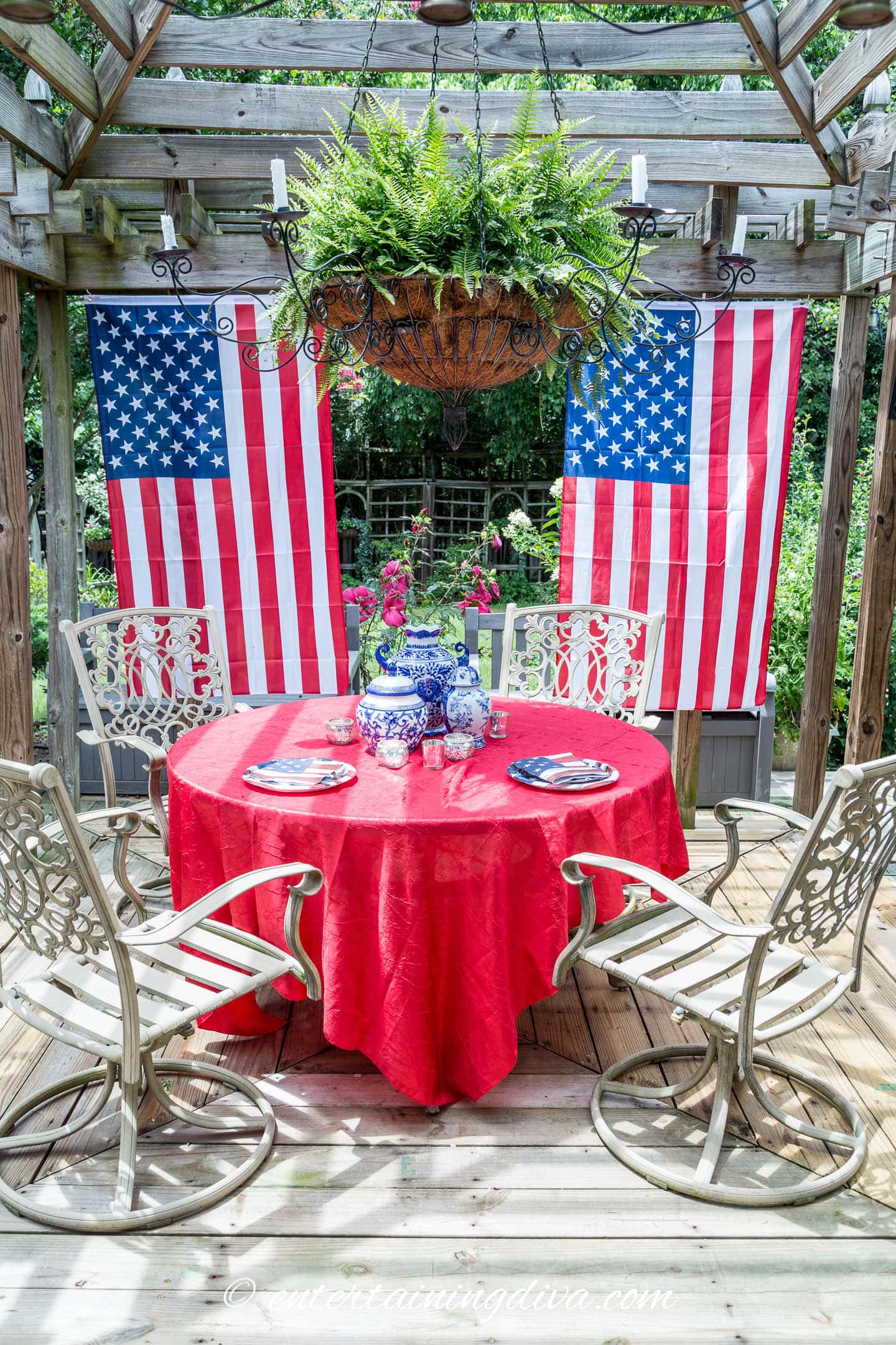 American flags hung from the back of a gazebo