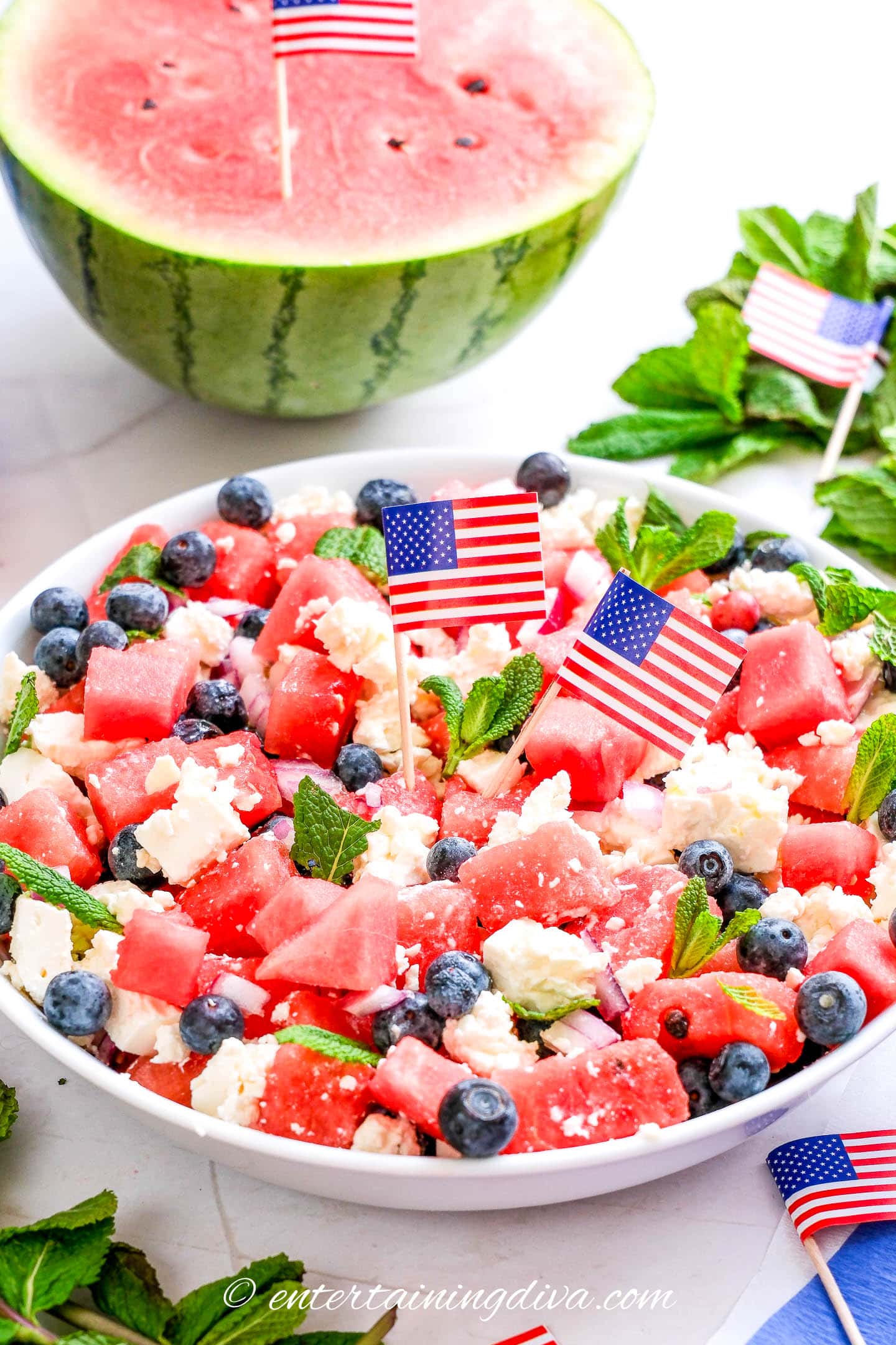 watermelon feta salad with 2 small American flags in the middle