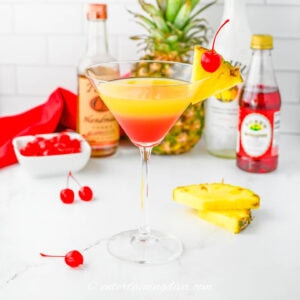 A side view of the layers in a pineapple upside down cake drink