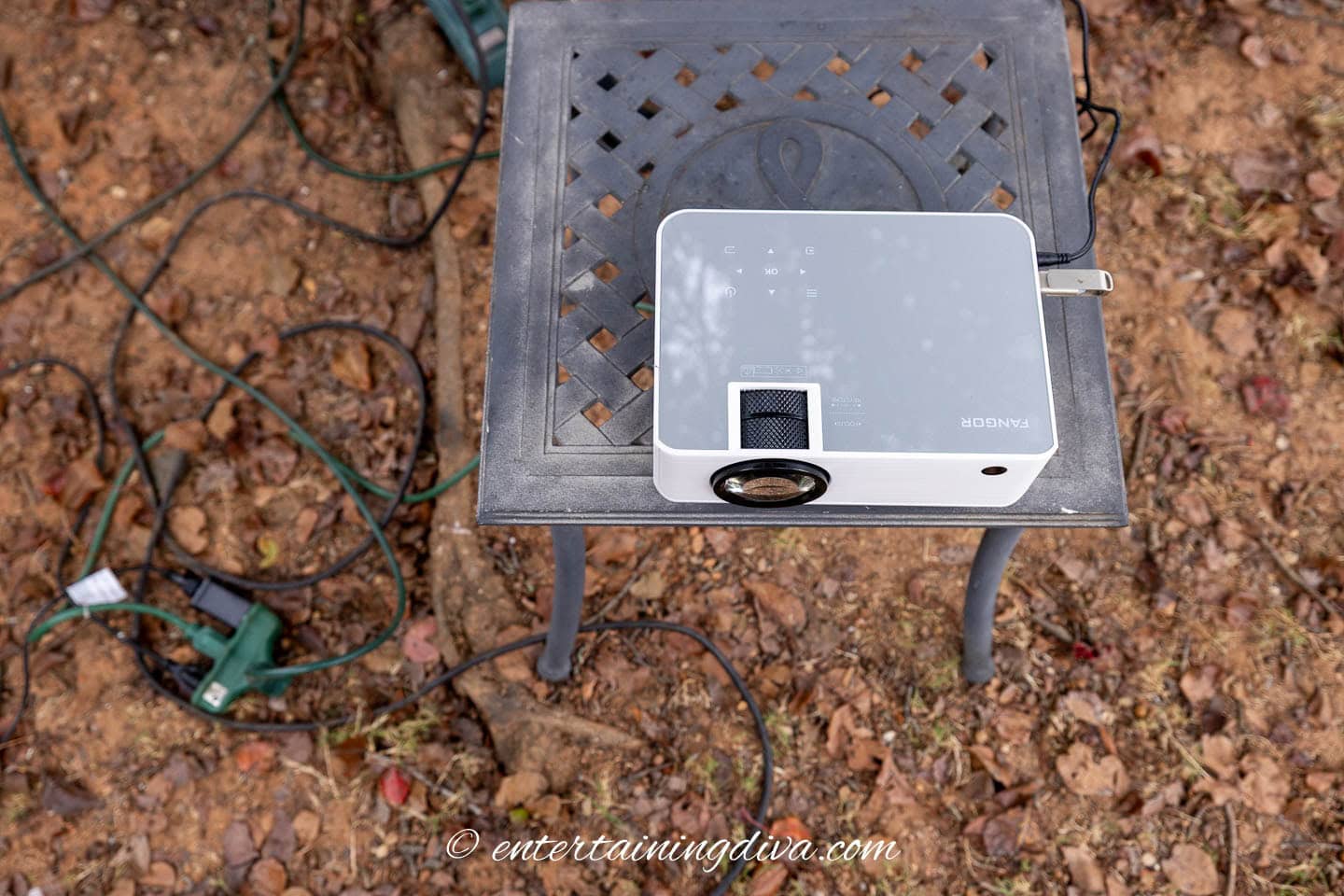 A projector on a small table outside