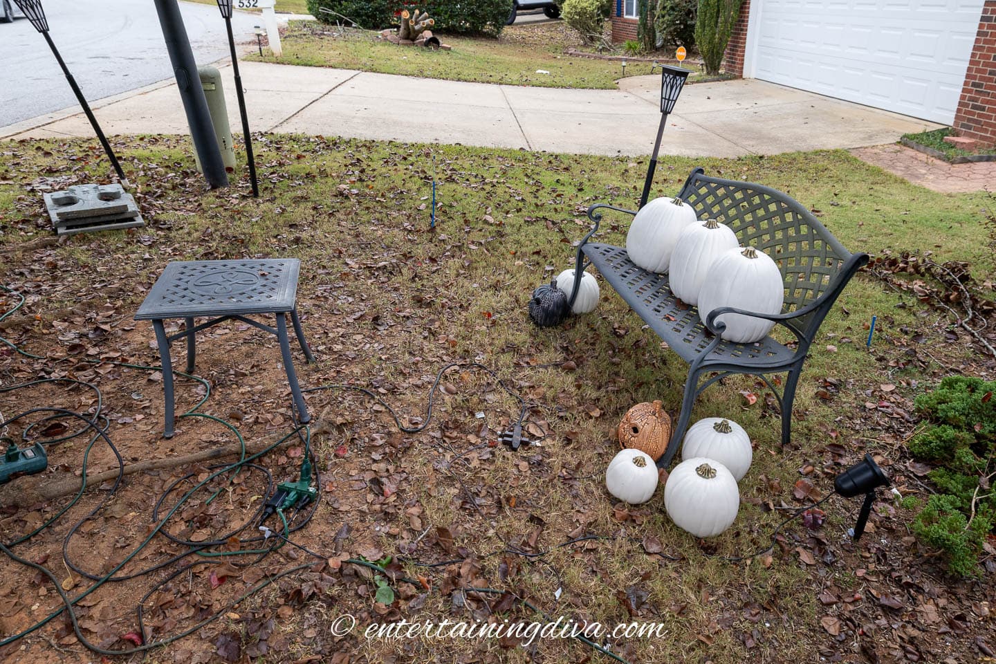 A table and bench set up for projecting onto pumpkins