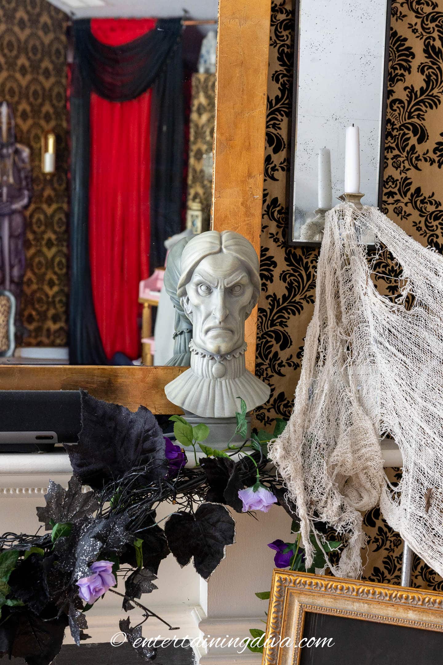 A haunted mansion bust on a fireplace mantel