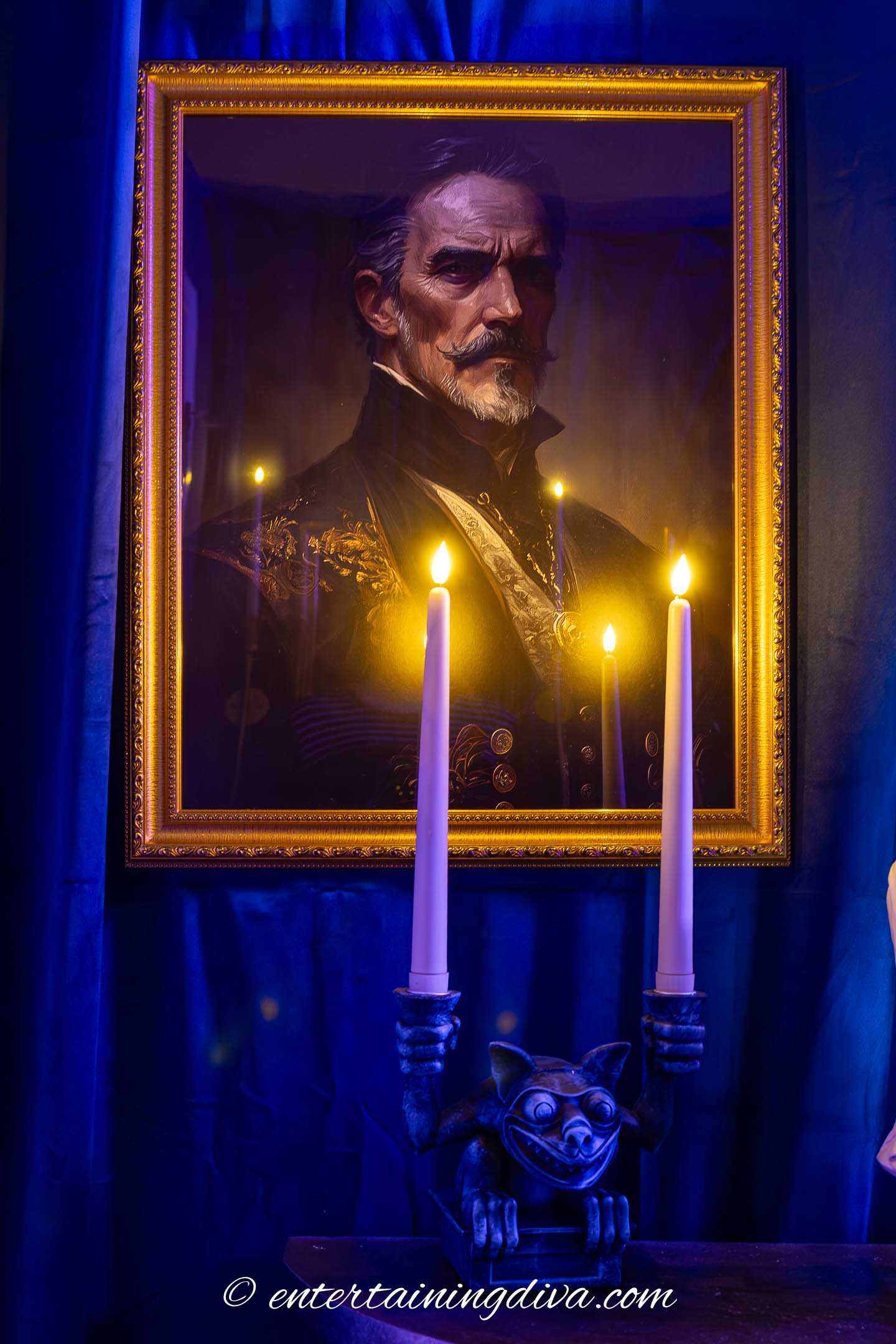 ghostly Victorian gentleman portrait above a gargoyle candelabra