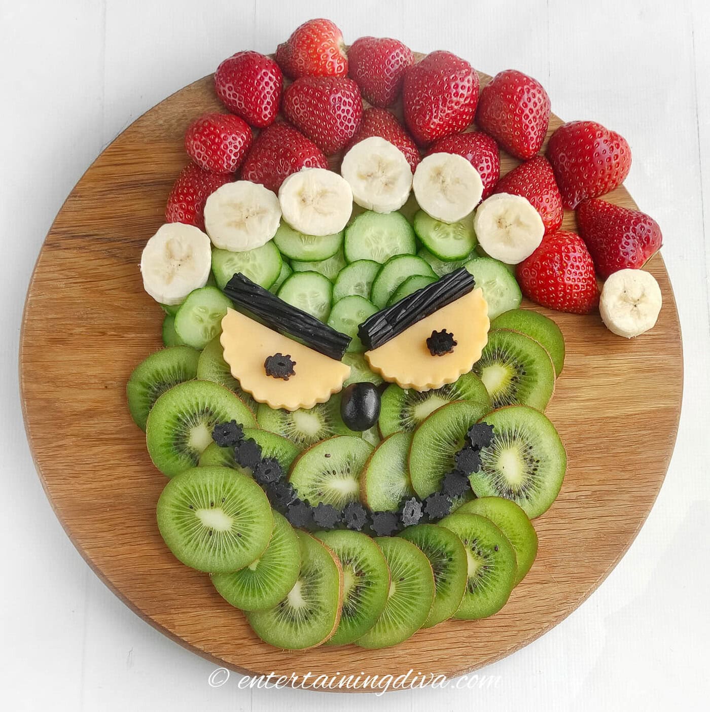 Super Cute Grinch Charcuterie Board With Fresh Fruit