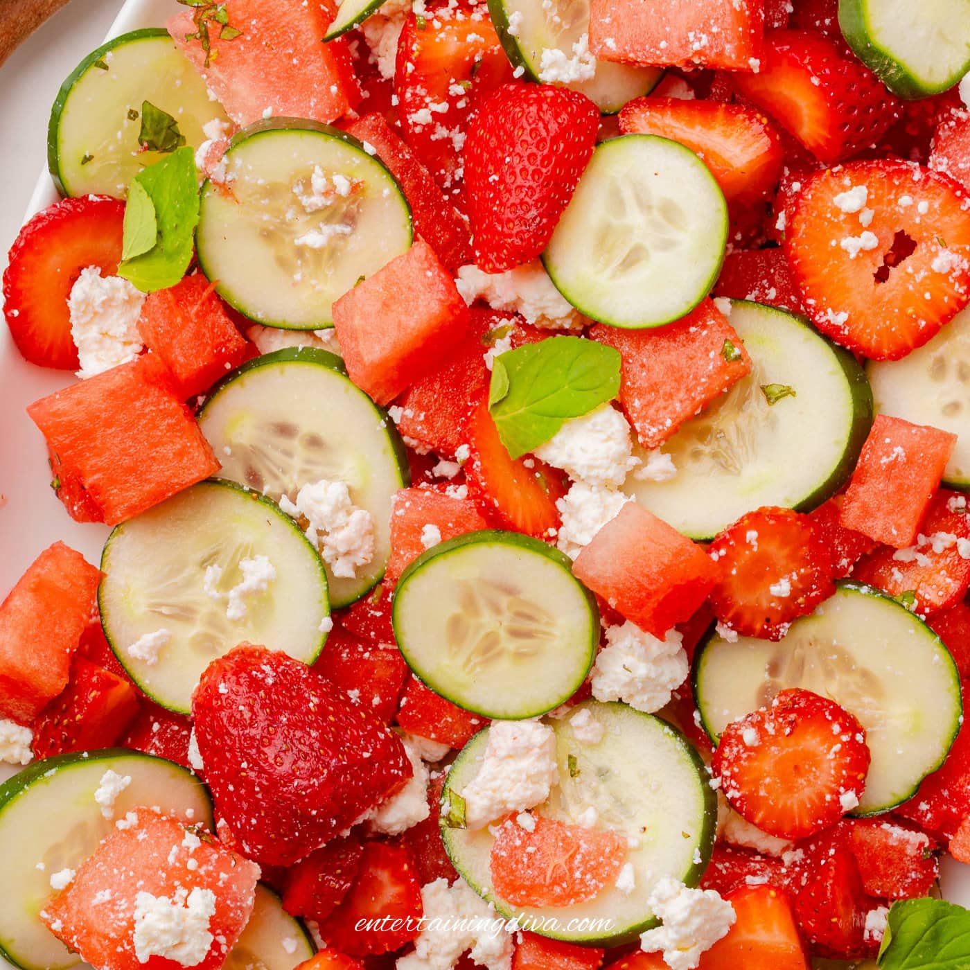 A close up of strawberry watermelon cucumber salad