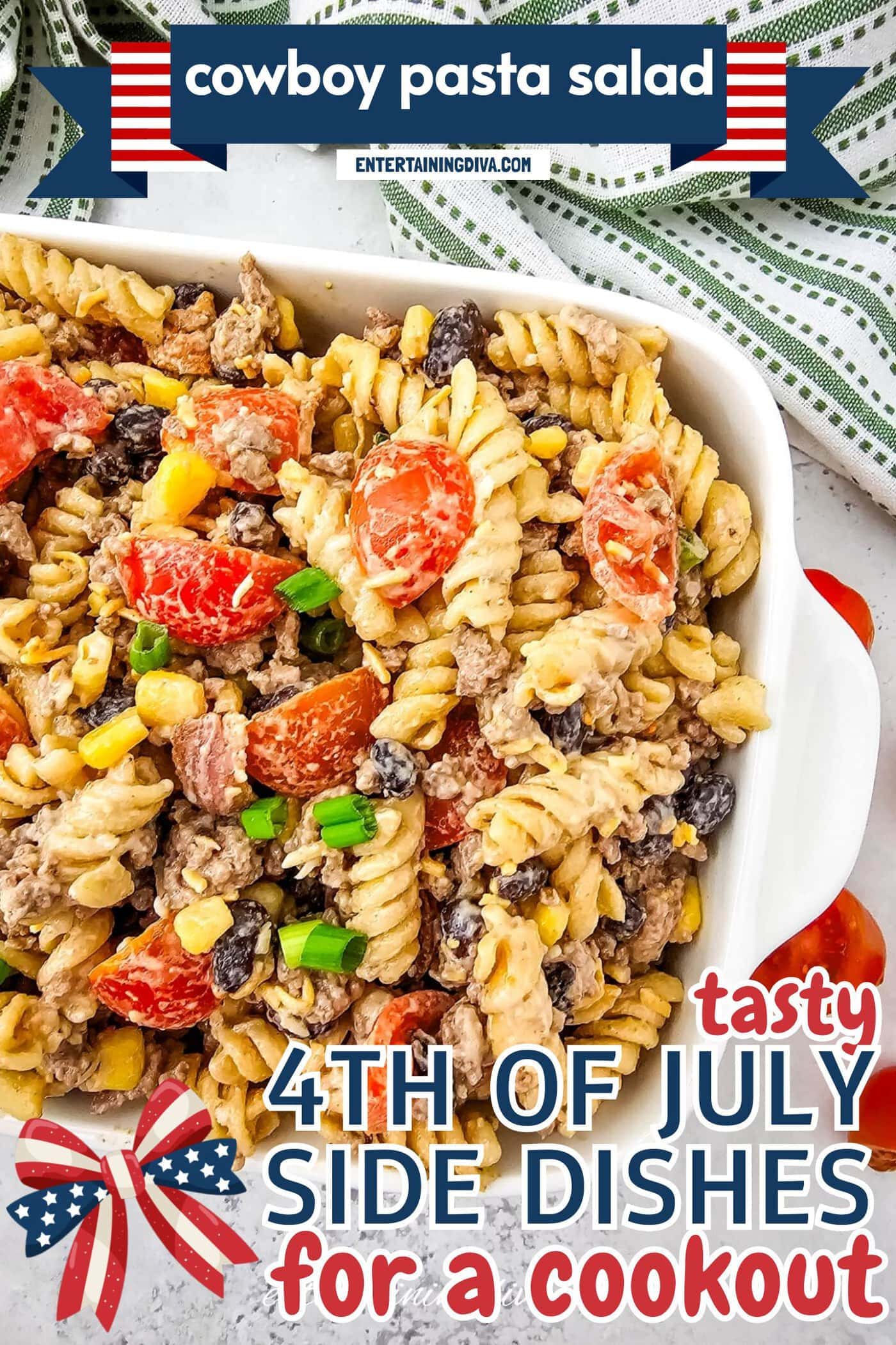 A white dish filled with rotini pasta salad mixed with ground meat, cherry tomatoes, corn, black beans, and chopped green onions.