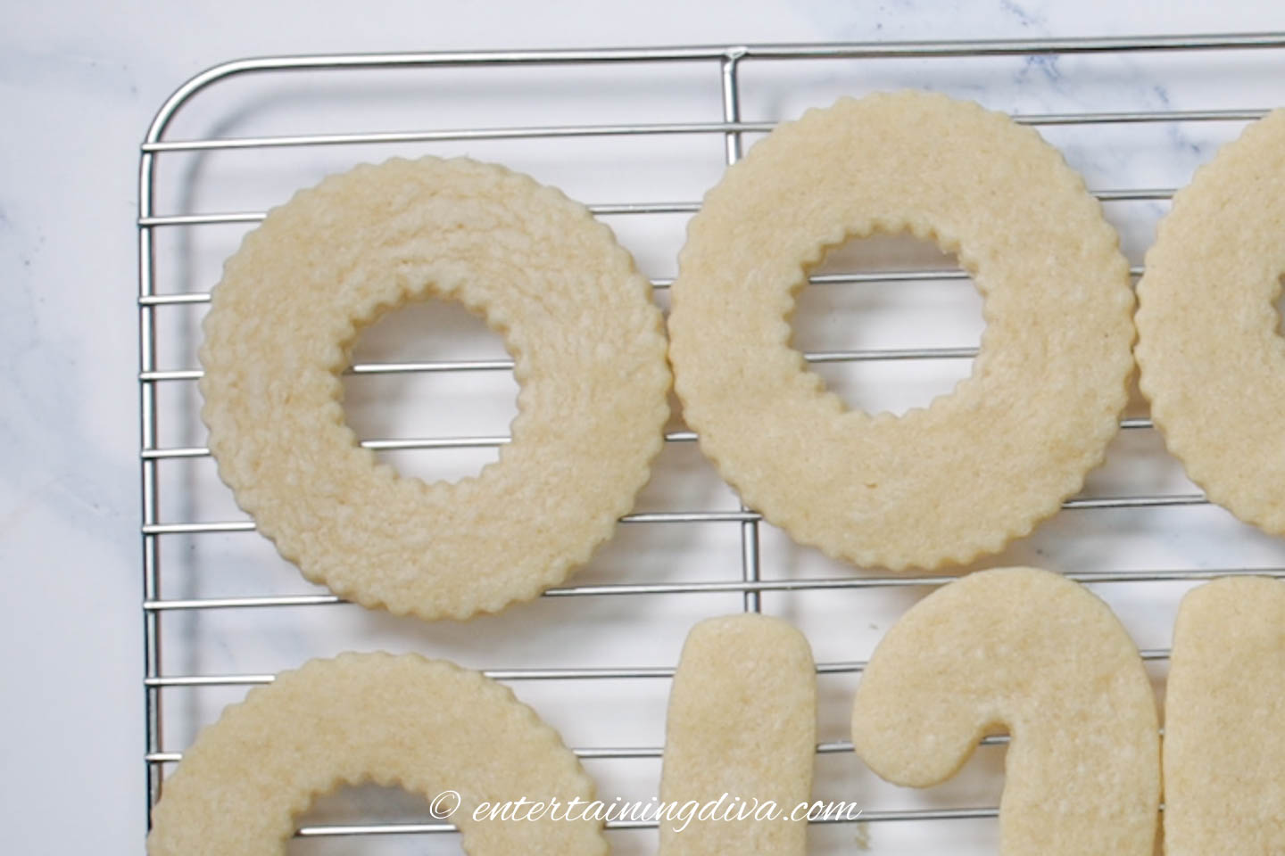 wreath sugar cookies on a cooling rack
