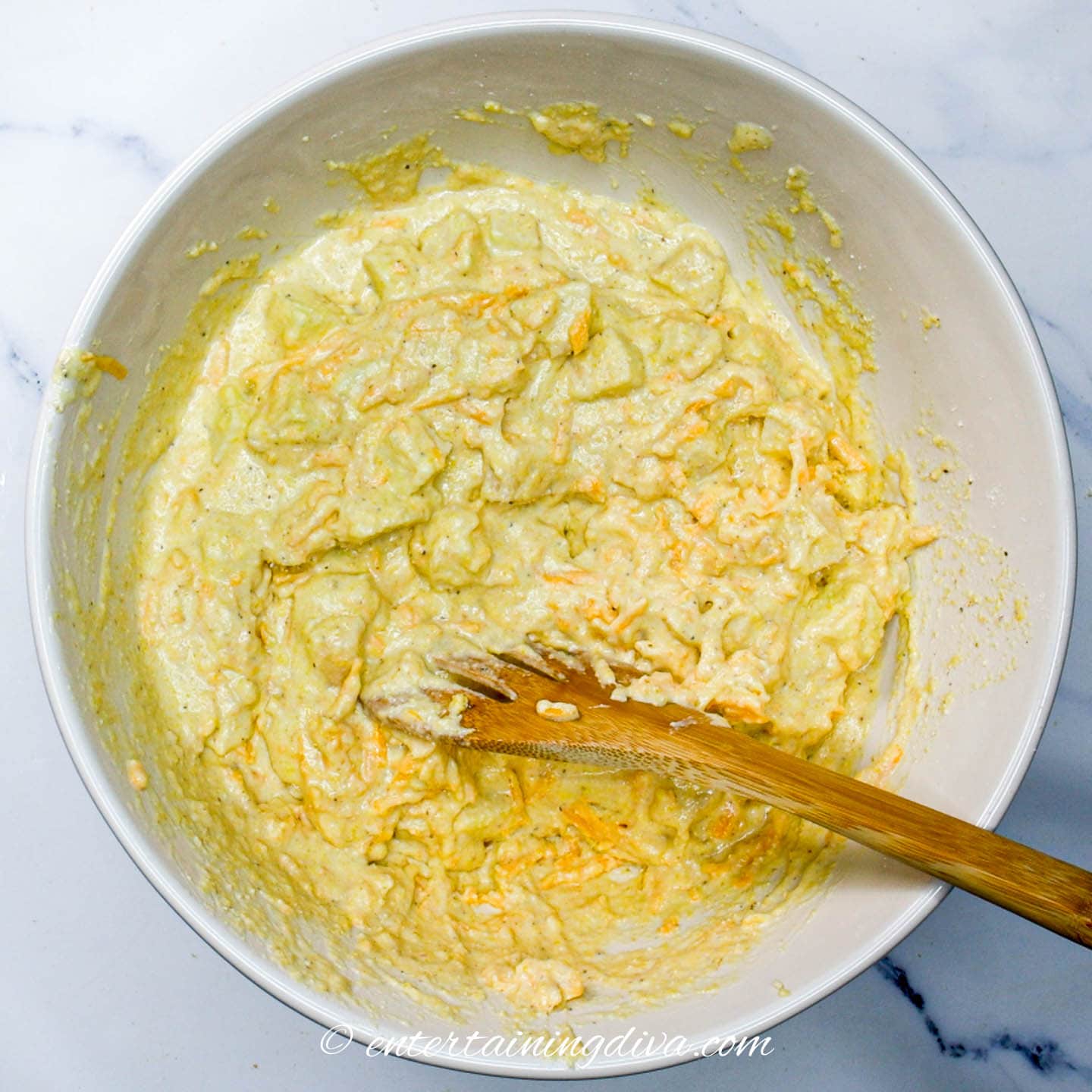 apple cheese cornbread batter in a bowl