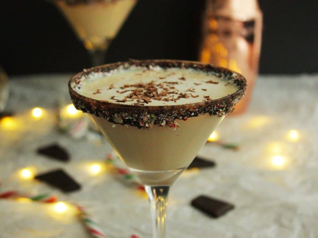 A martini with chocolate and peppermint garnish.