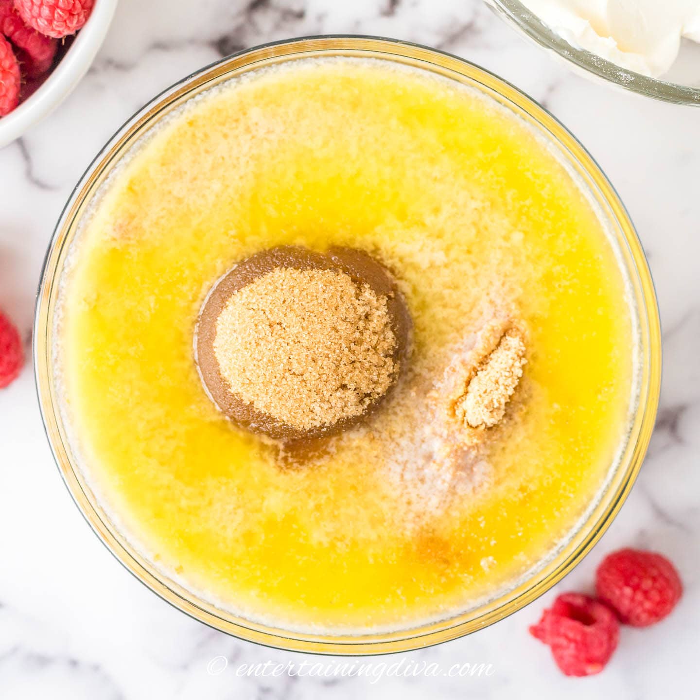 melted butter and graham cracker crumbs in a mixing bowl