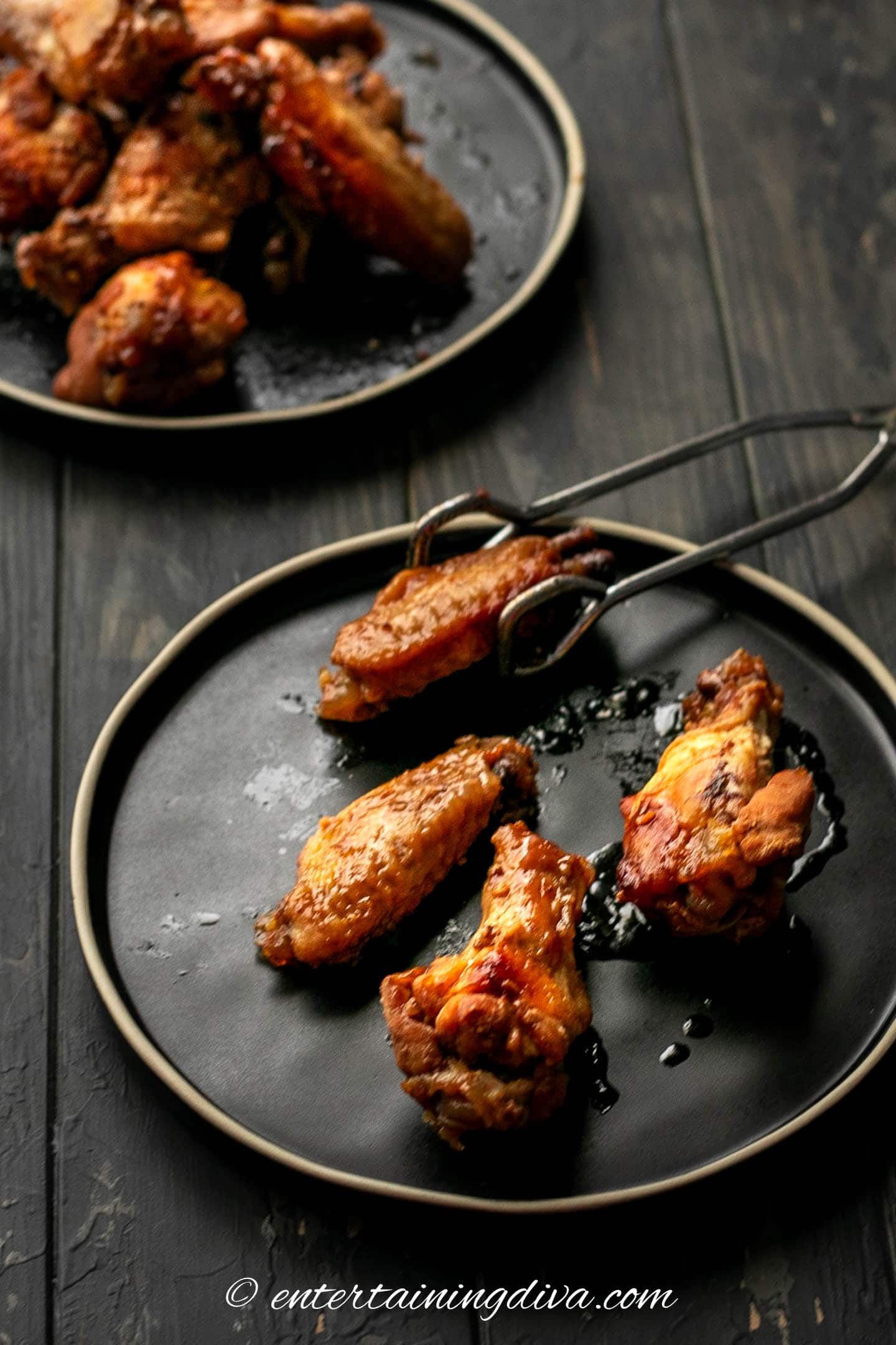 baked sticky chinese chicken wings on a plate