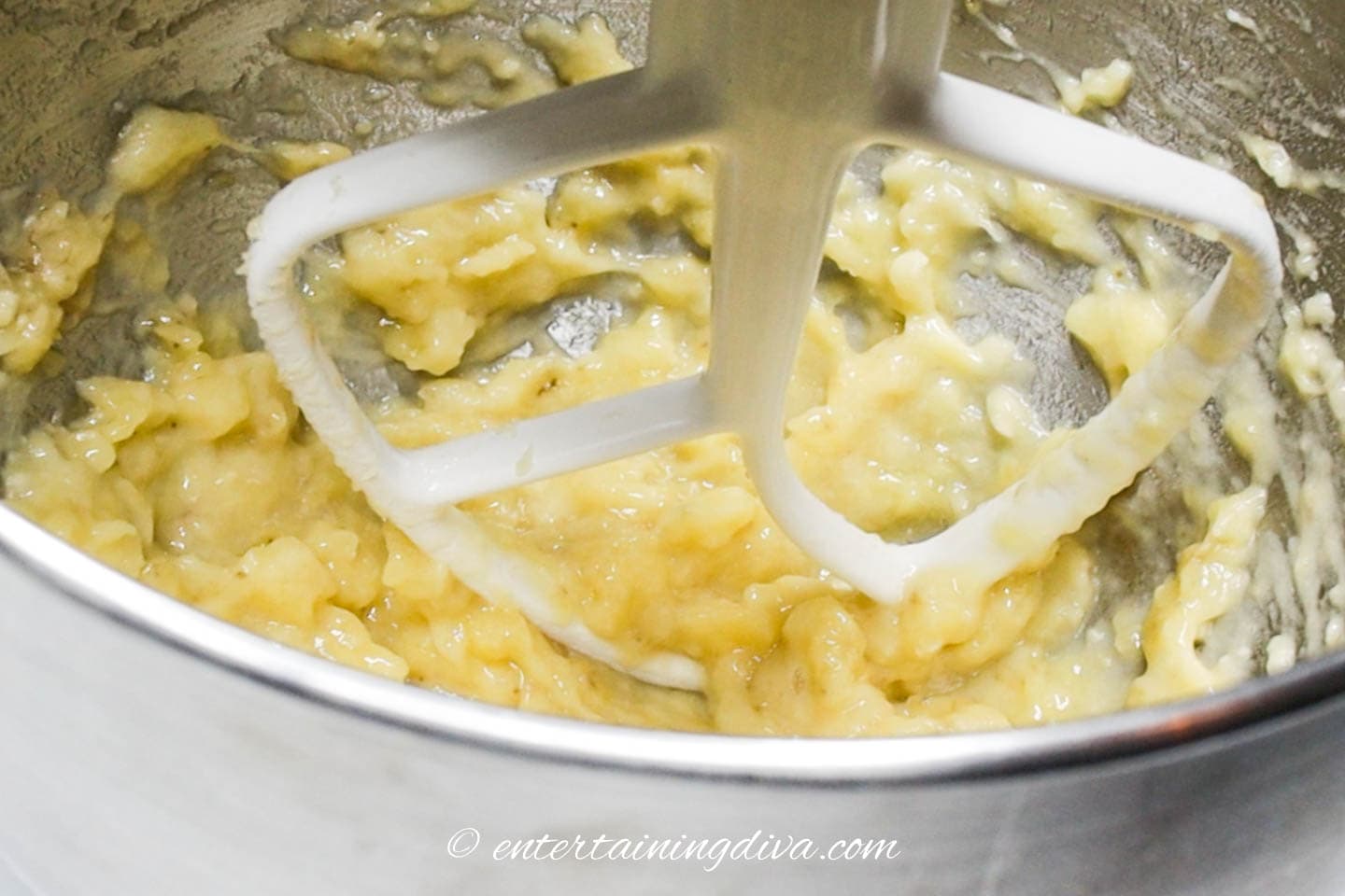 bananas mashed in a mixing bowl
