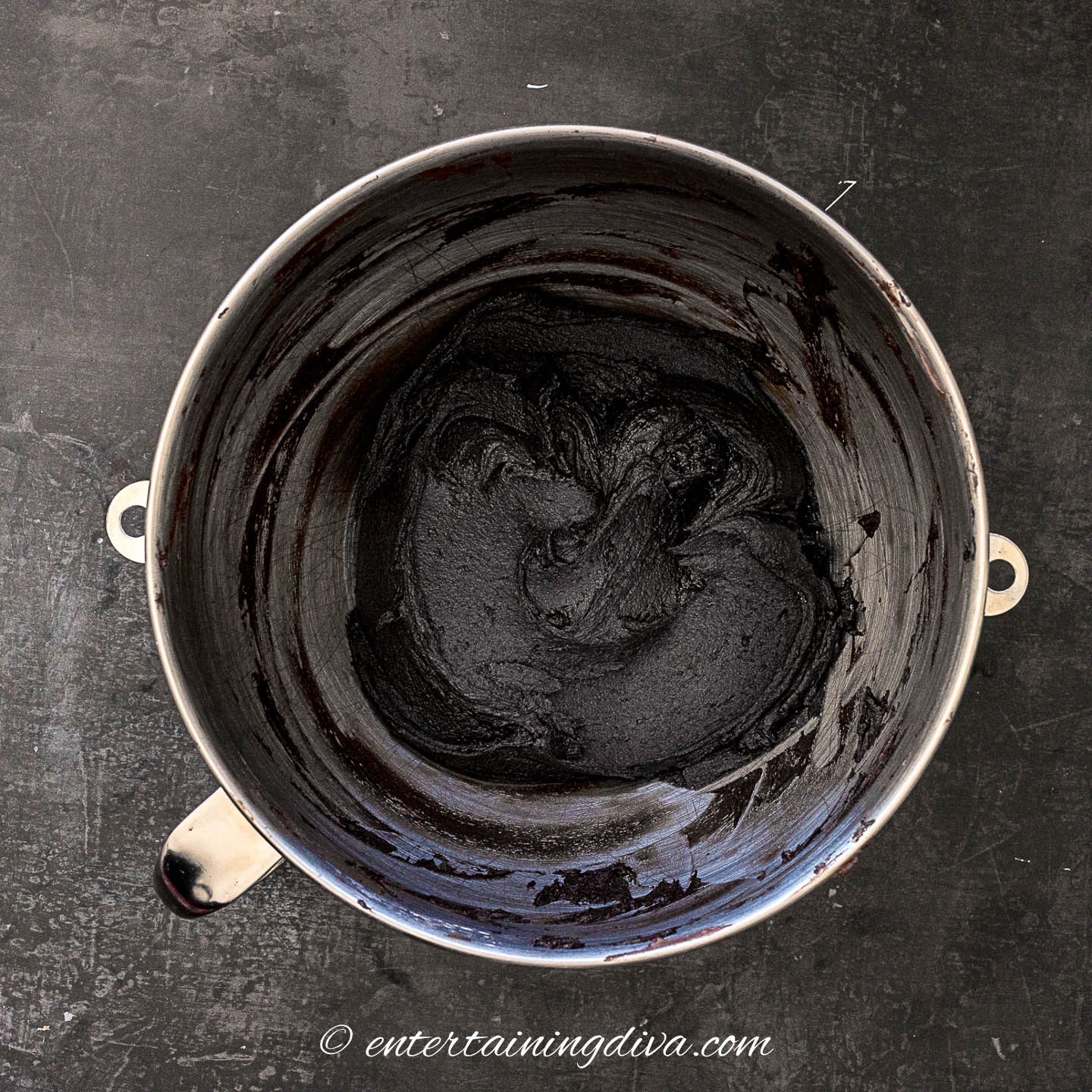 black chocolate buttercream frosting in a mixing bowl