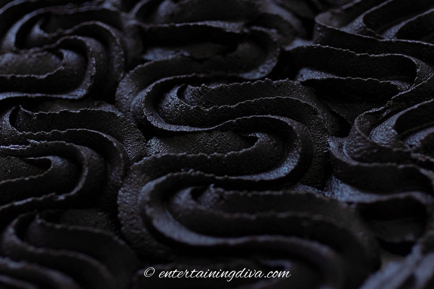 close up of black chocolate buttercream frosting