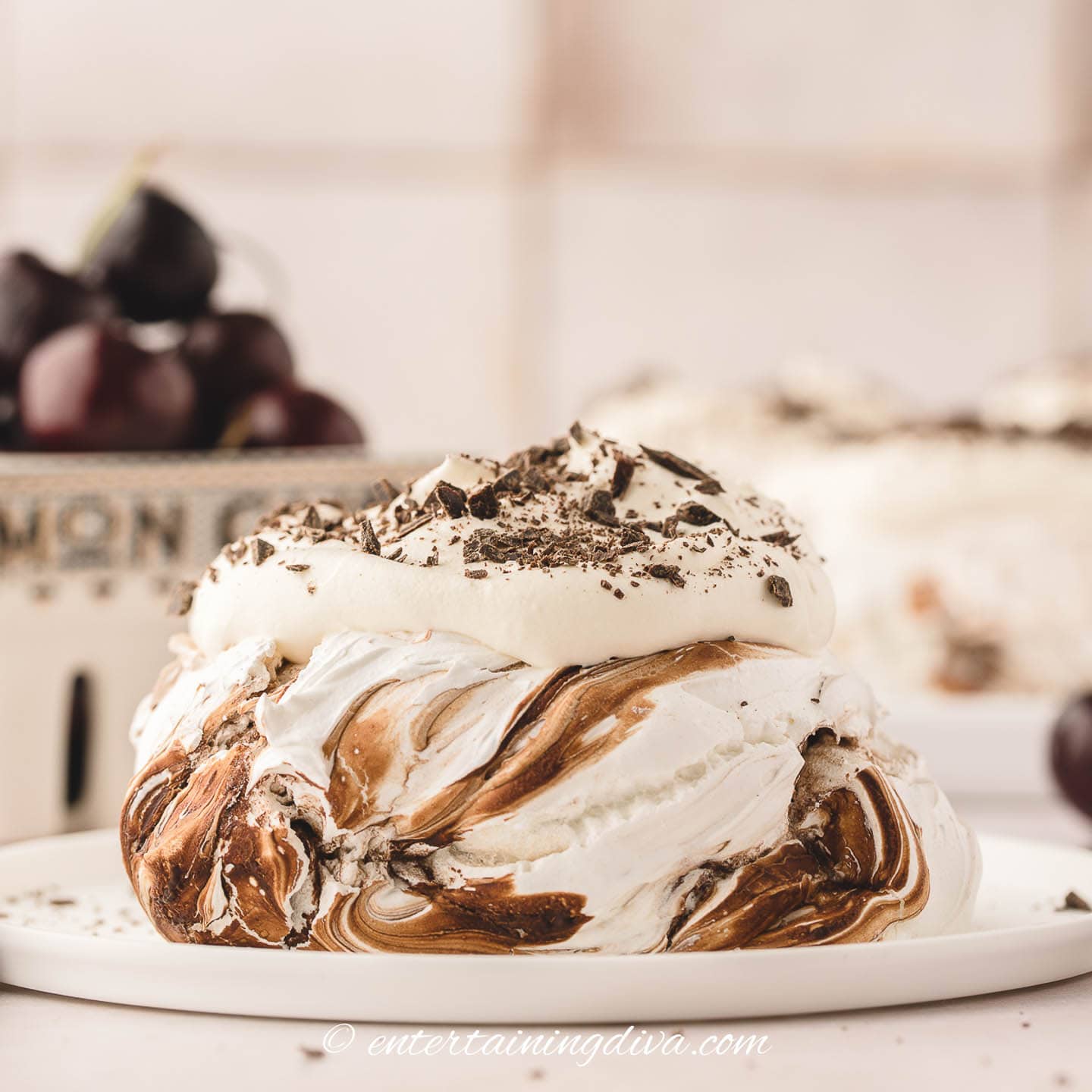 Marbled chocolate mini pavlova with whipped cream and grated chocolate on top