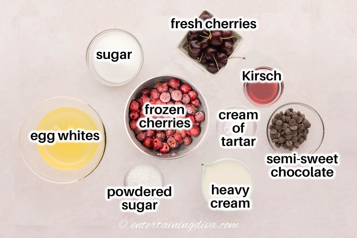 black forest mini pavlovas ingredients - egg whites, sugar, cream of tartar, heavy cream, powdered sugar, frozen and fresh cherries, kirsch and semi sweet chocolate