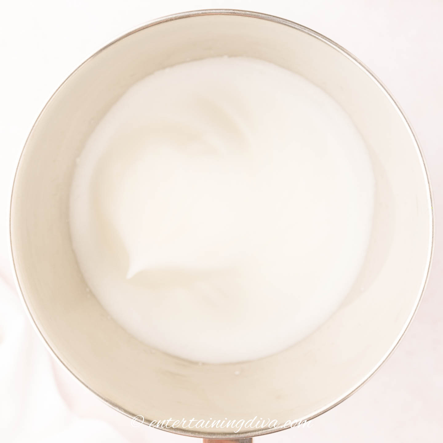 Whipped egg whites in a mixing bowl