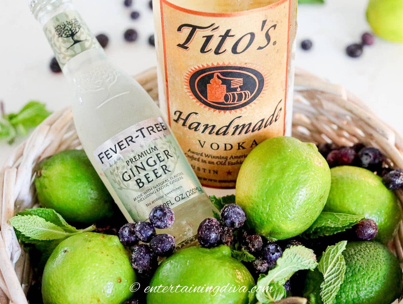 blueberry moscow mule ingredients - vodka, ginger beer, limes, blueberries, mint