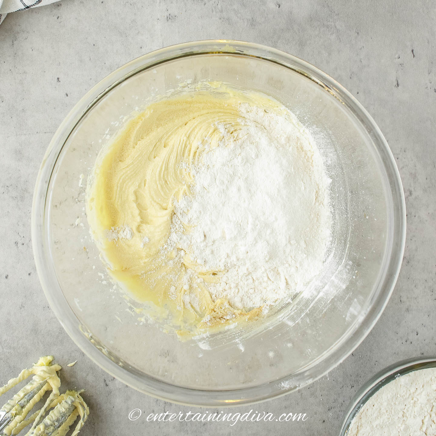 dry ingredients on top of wet ingredients in a mixing bowl