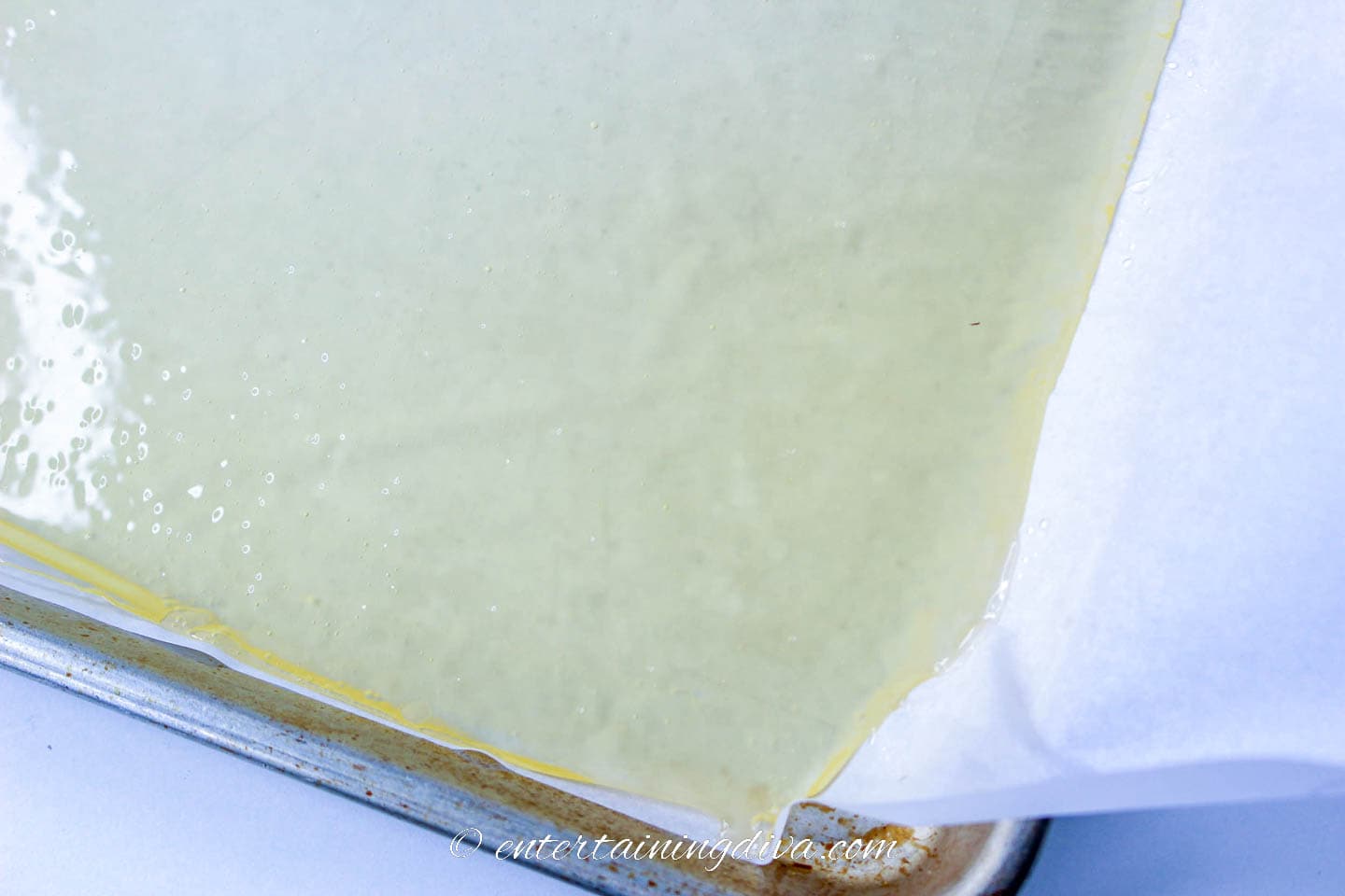 candy glass on parchment paper in a baking sheet